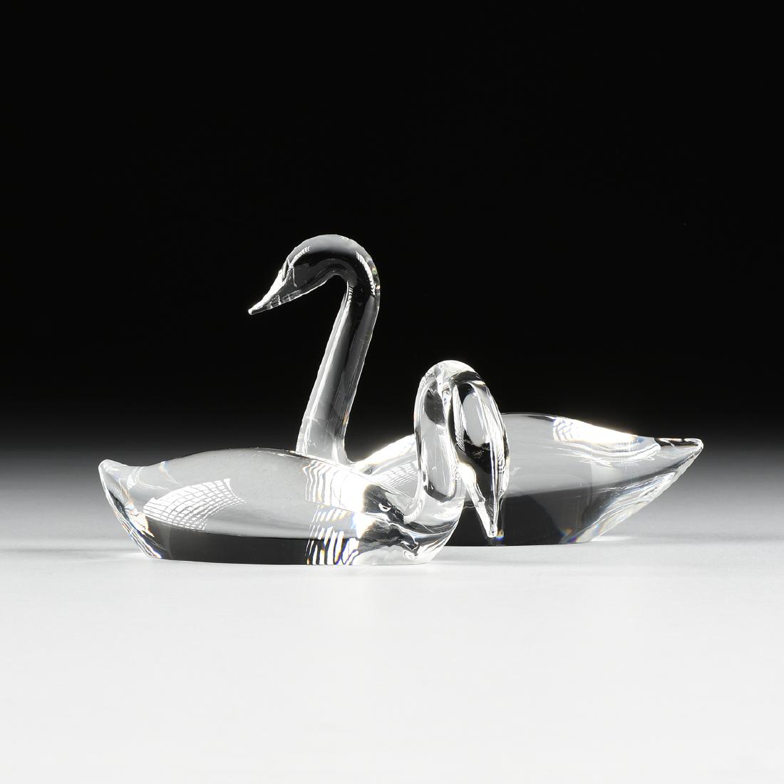 LLOYD ATKINS (American 1922-2002) A GROUP OF TWO: LLOYD ATKINS (American 1922-2002) A GROUP OF TWO CRYSTAL SCULPTURES: "SWANS," FOR STEUBEN GLASSWORKS, CORNING, NEW YORK, DATED 1988, comprising a figure of a swan with head gracefully held aloft, with