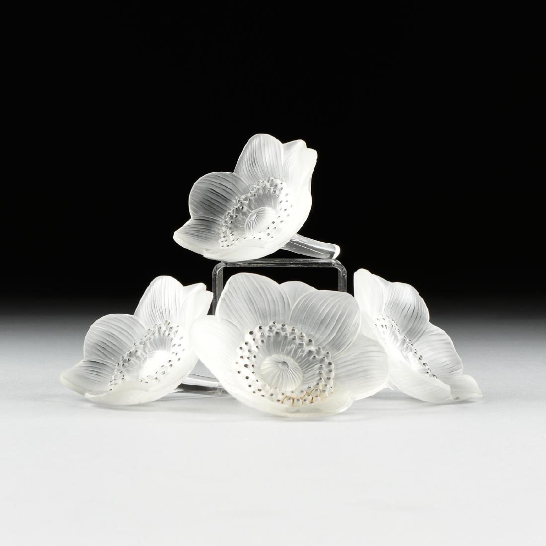 A SET OF FOUR CONTINENTAL FROSTED GLASS ANEMONE,: A SET OF FOUR CONTINENTAL FROSTED GLASS ANEMONE, POSSIBLY CZECH, 20TH CENTURY, each closely modeled in the Lalique Anemone pattern and bearing a form of the "R. LALIQUE" signature, length: 4 1/12". NO