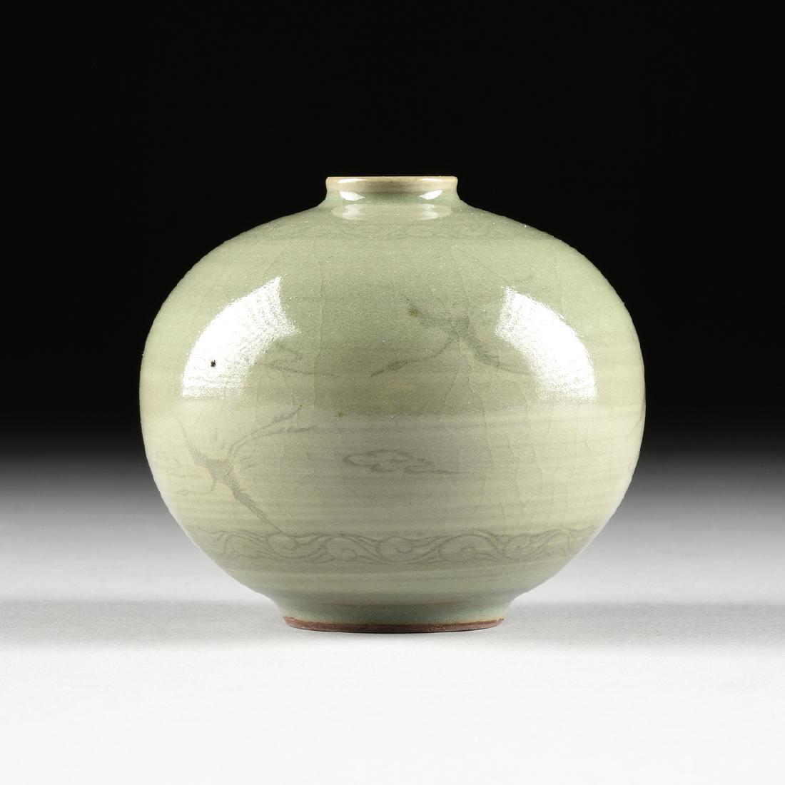 A KOREAN CELADON GLAZED EARTHENWARE OIL BOTTLE, IN THE: A KOREAN CELADON GLAZED EARTHENWARE OIL BOTTLE, IN THE GORYEO DYNASTY (918-1392) STYLE, the slightly rolled mouth, over a globular body with repeating scroll collar, over clouds and cranes in flight o