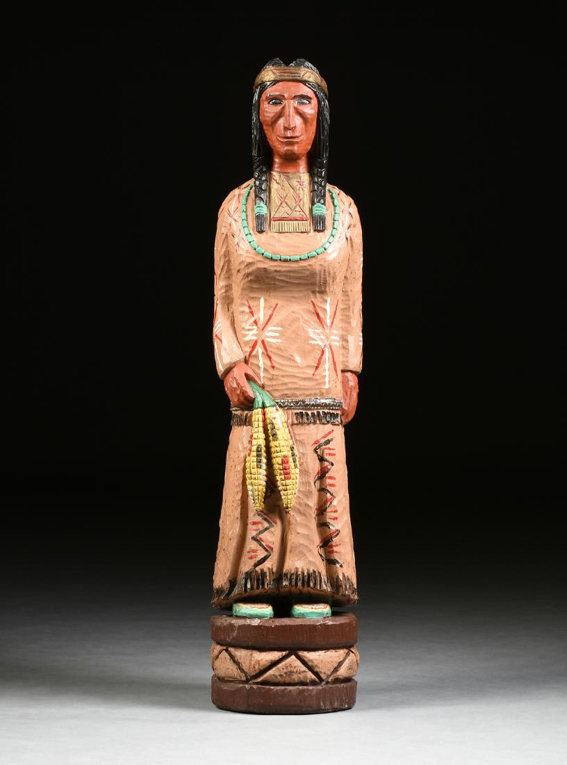 A NATIVE AMERICAN CIGAR STORE INDIAN FEMALE STATUE,: A NATIVE AMERICAN CIGAR STORE INDIAN FEMALE STATUE, FRANK GALLAGHER (Mandan Tribe active 1840s), NORTH DAKOTA, on integral plinth, verso signed. Height: 52.50"