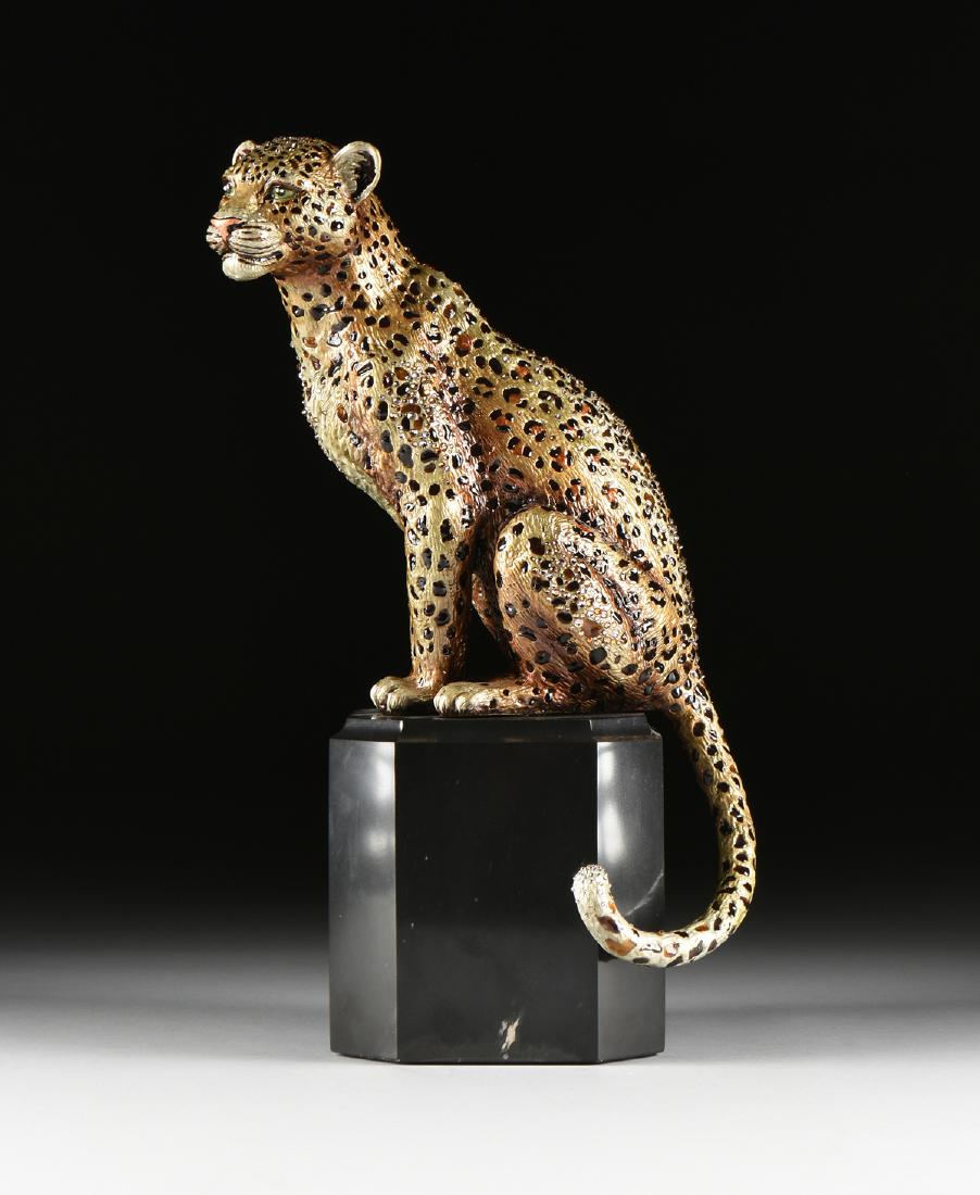 JAY STRONGWATER (American b. 1960) A GILT METAL LEOPARD: JAY STRONGWATER (American b. 1960) A GILT METAL LEOPARD FIGURINE, "Seated Leopard," modeled as a gilt and polychrome enameled metal leopard with handset Swarovski crystal details, seated on an octagon