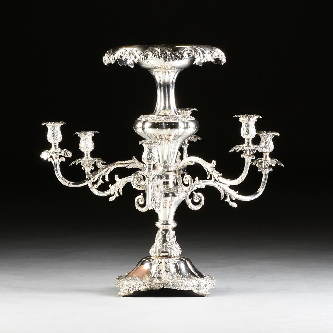 AN ENGLISH VICTORIAN SILVER PLATED FOUR BRANCH EPERGNE,: AN ENGLISH VICTORIAN SILVER PLATED FOUR BRANCH EPERGNE, POSSIBLY SHEFFIELD, THIRD QUARTER 19TH CENTURY, in the Rococo Revival style, with a broad circular shallow basin top within a rounded rim contin