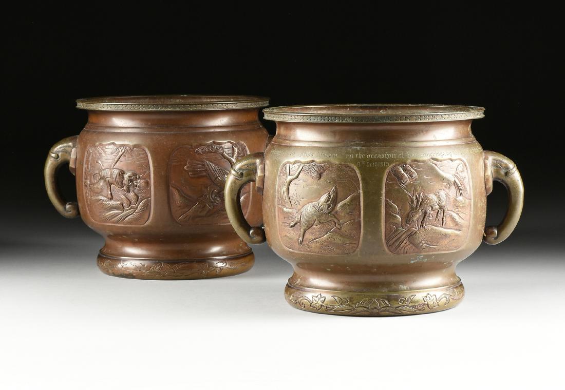 A PAIR OF JAPANESE PATINATED BRONZE TWO HANDLED: A PAIR OF JAPANESE PATINATED BRONZE TWO HANDLED JARDINIÈRES, MEIJI PERIOD, LATE 19TH/EARLY 20TH CENTURY, each of squat bulbous form and sides centering rectangular fan shaped reserves, enclosing a ti