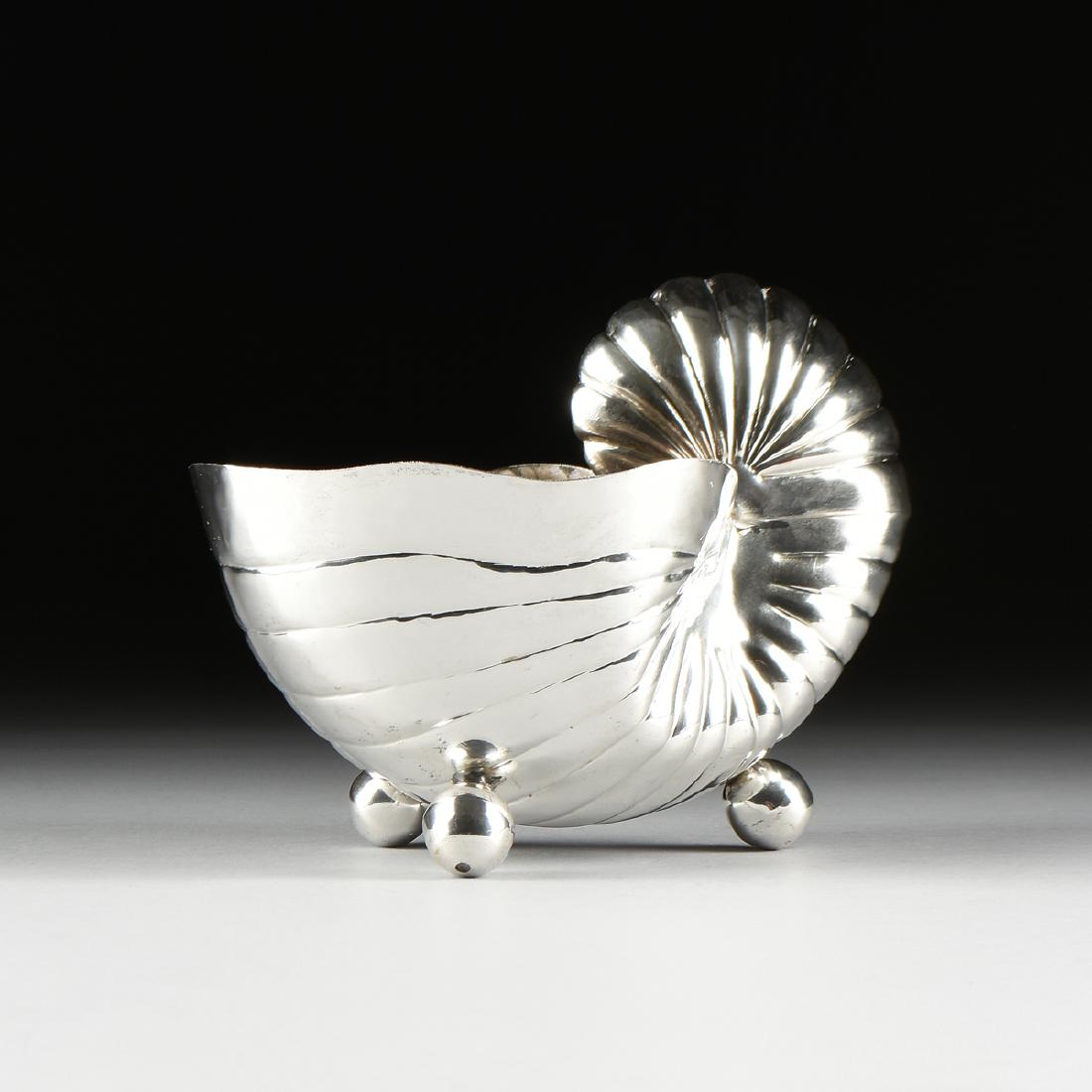 A SILVER PLATE NAUTILUS SHELL CENTERPIECE, MID 20TH: A SILVER PLATE NAUTILUS SHELL CENTERPIECE, MID 20TH CENTURY in the Renaissance taste, raised on ball feet. Height: 8.00" Width: 10.00" Depth: 7.00"