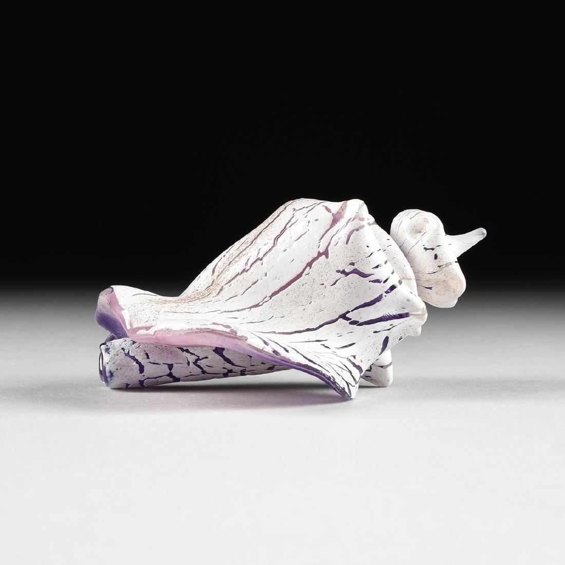 A CONTEMPORARY ART GLASS CONCH SHELL SCULPTURE, SIGNED,: A CONTEMPORARY ART GLASS CONCH SHELL SCULPTURE, SIGNED, LATE 20TH CENTURY, in natural conch shell form with white cased exterior detailed with long jagged splits revealing a dark dusty pink colored bo