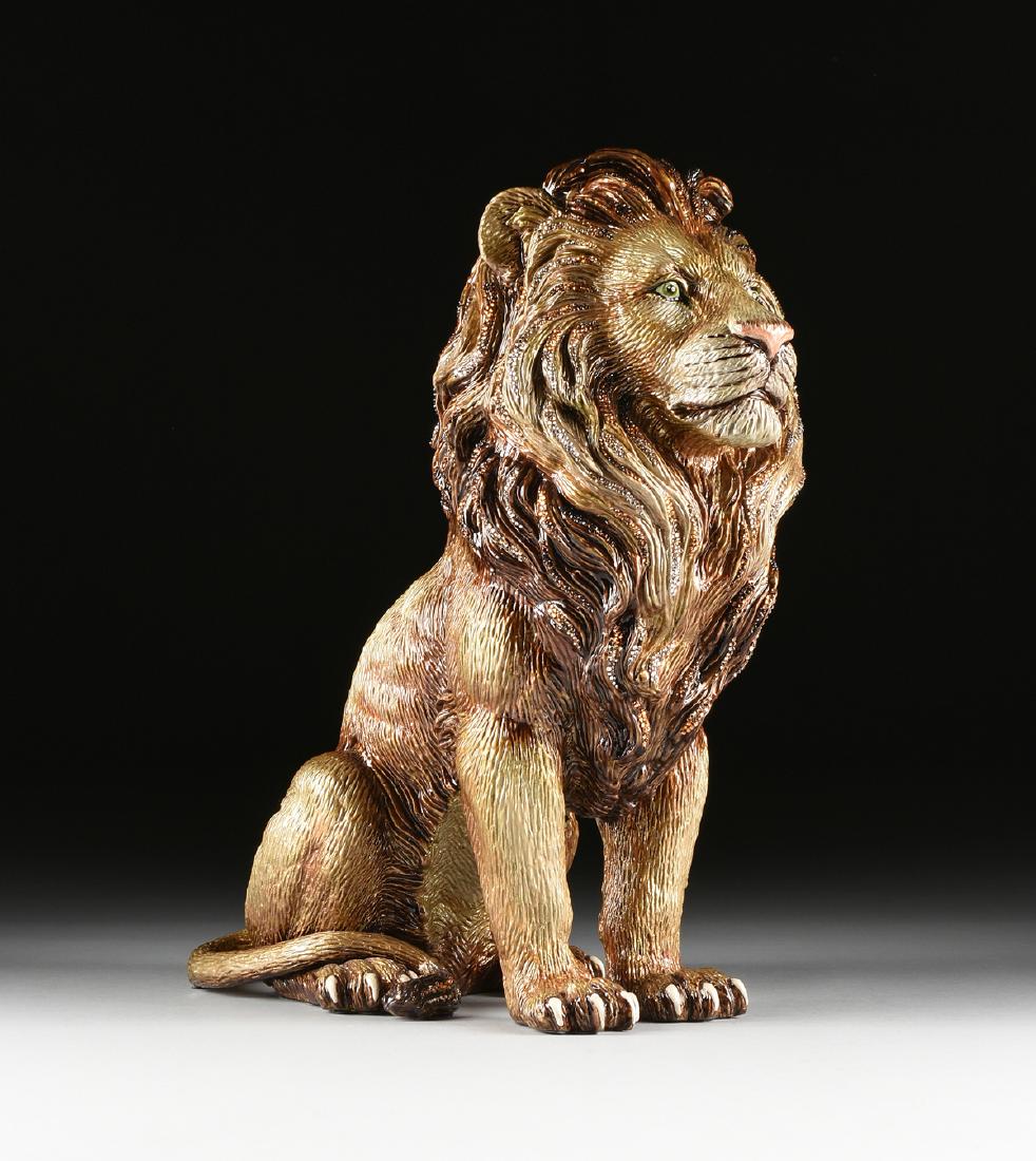 JAY STRONGWATER (American b. 1960) A GILT METAL LION: JAY STRONGWATER (American b. 1960) A GILT METAL LION FIGURINE, "Majestic Lion," modeled as a gilt and polychrome enameled metal seated lion with handset Swarovski crystal details, back verso applied w