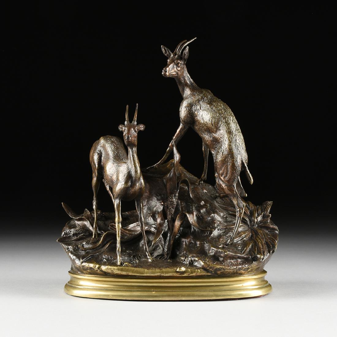 after a model by JULES MOIGNIEZ (French 1835-1894), A: after a model by JULES MOIGNIEZ (French 1835-1894), A BRONZE GROUP, "Two Chamois," a patinated cast bronze group of two young horned chamois, modeled in an alert stance on boulder groundwork with nati
