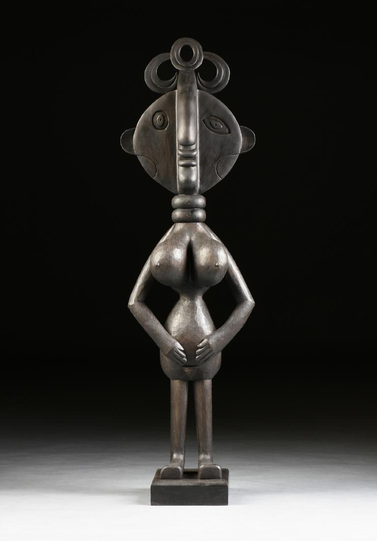 after PABLO PICASSO (Spanish 1881-1973) A CUBIST: after PABLO PICASSO (Spanish 1881-1973) A CUBIST SCULPTURE, "Fertility Goddess," ebonized wood on stand. Height: 51.00" Width: 15.00" Depth: 12.50"