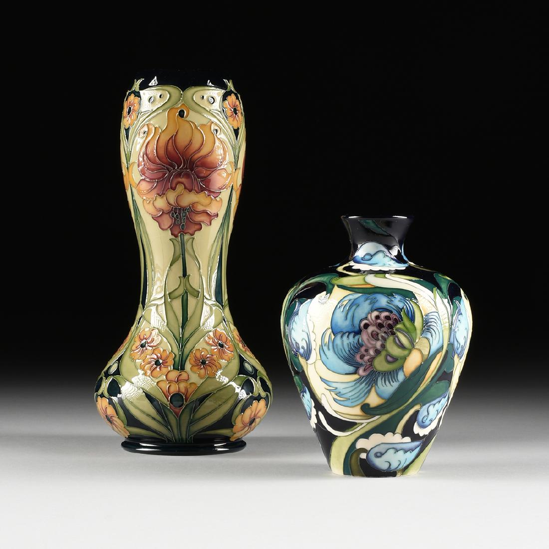 A GROUP OF TWO MOORCROFT ART POTTERY VASES, PATTERNS BY: A GROUP OF TWO MOORCROFT ART POTTERY VASES, PATTERNS BY EMMA BOSSONS, F.R.S.A. AND RACHEL BISHOP, ENGLISH, a bottle vase, with cobalt ground and blue flowers in the Art Deco taste, verso impressed mar