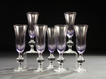 A SERVICE OF SEVEN VENETIAN STYLE CRYSTAL CHAMPAGNE