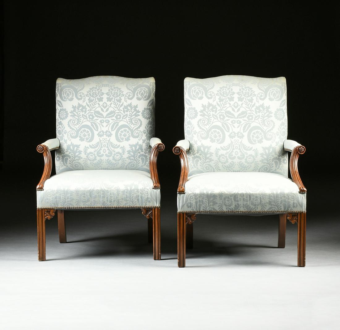 A PAIR OF BAKER FURNITURE ARMCHAIRS, AMERICAN, CIRCA: A PAIR OF BAKER FURNITURE ARMCHAIRS, AMERICAN, CIRCA 1976, in the Chippendale style, the arched rectangular back over trapezoidal seats within outswept upholstered arms ending in rosette hand ter