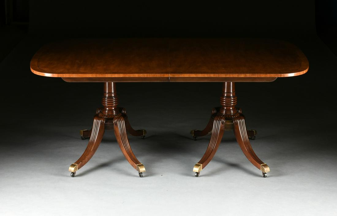 A VINTAGE BAKER FURNITURE DINING TABLE, CIRCA 1976,: A VINTAGE BAKER FURNITURE DINING TABLE, CIRCA 1976, a neoclassical style dining table with a string inlaid, rounded corner top, over ring turned, tapered double pedestals, raised on scrolled and flute