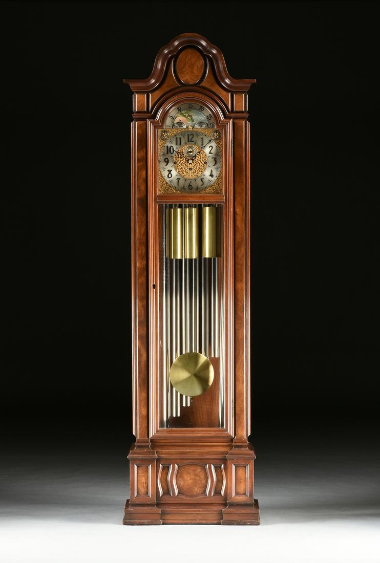 A HERSCHEDE "SHEFFIELD" MODEL 230 LONG CASE TUBULAR: A HERSCHEDE "SHEFFIELD" MODEL 230 LONG CASE TUBULAR BELL CLOCK, AMERICAN, 1976, a mixed solid and veneer cherry case, the arched clock face with landscape painted detail, over a machine worked gilt Ar