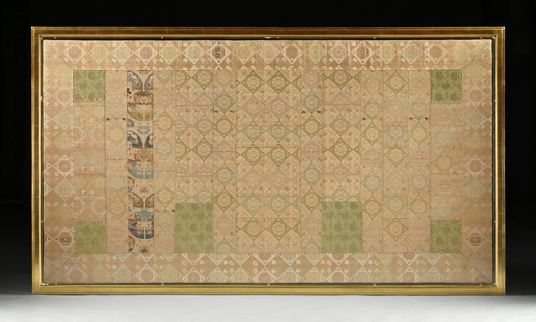 AN ANTIQUE JAPANESE BUDDHIST PRIEST SILK BROCADE KESA: AN ANTIQUE JAPANESE BUDDHIST PRIEST SILK BROCADE KESA ROBE, 18TH/19TH CENTURY, of rectangular form and conforming border centering a row of lozenge reserves of four flower cornered stylized blooms fla