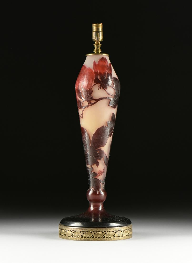 A GALLÉ CAMEO GLASS "MAGNOLIA" TABLE LAMP BASE, SIGNED,: A GALLÉ CAMEO GLASS "MAGNOLIA" TABLE LAMP BASE, SIGNED, CIRCA 1920, polished blossoming magnolia stems in double maroon tones on a frosted lemon yellow ground, cameo signed "Gallé," the tape