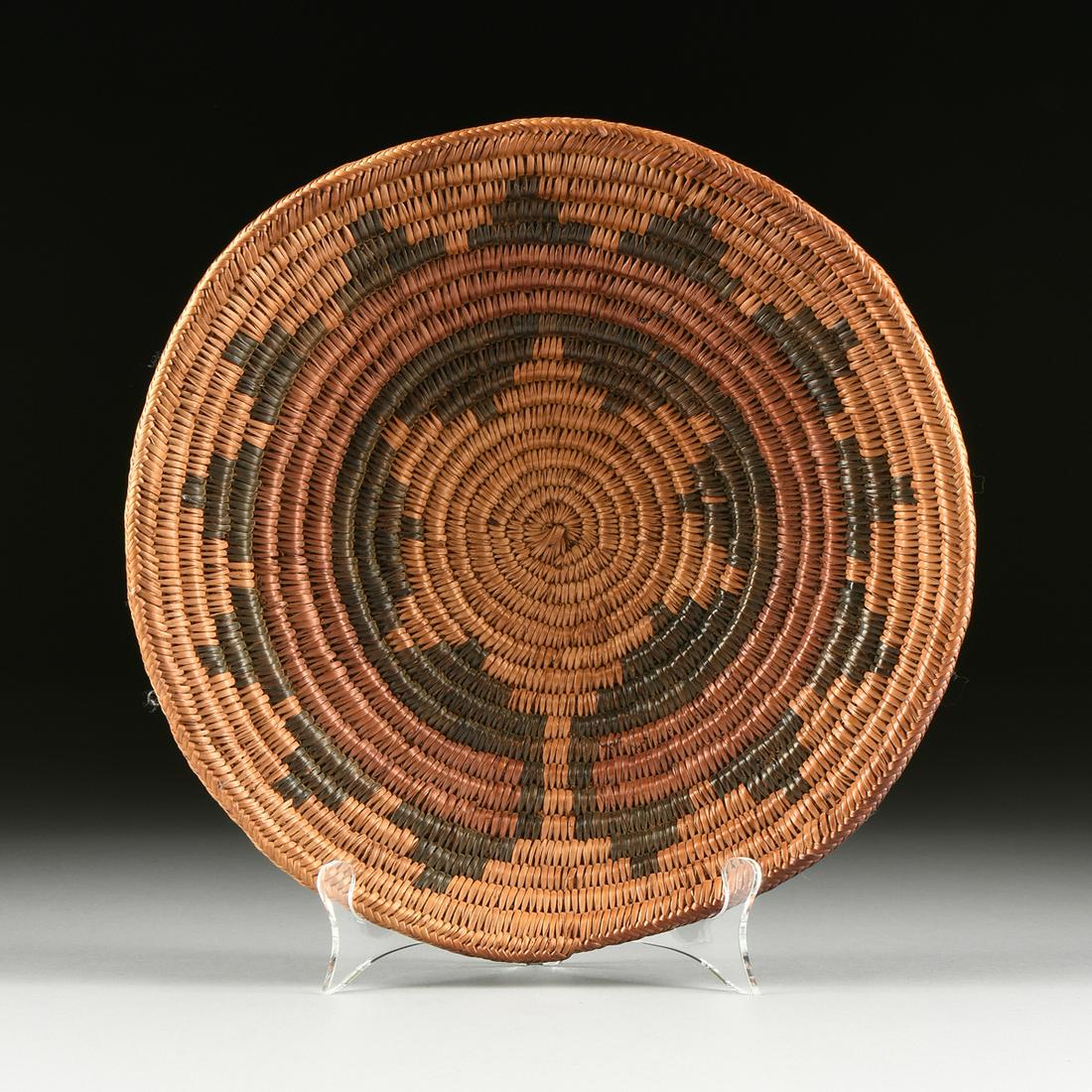A NATIVE AMERICAN WOVEN "Ts'aa Baa Hane'" CEREMONIAL: A NATIVE AMERICAN WOVEN "Ts'aa Baa Hane'" CEREMONIAL BASKET, EARLY/MID 20TH CENTURY, the "Wedding" basket, composed of tightly coiled, naturally dyed sumac, with herringbone edge. Diameter: 12 3/4" No