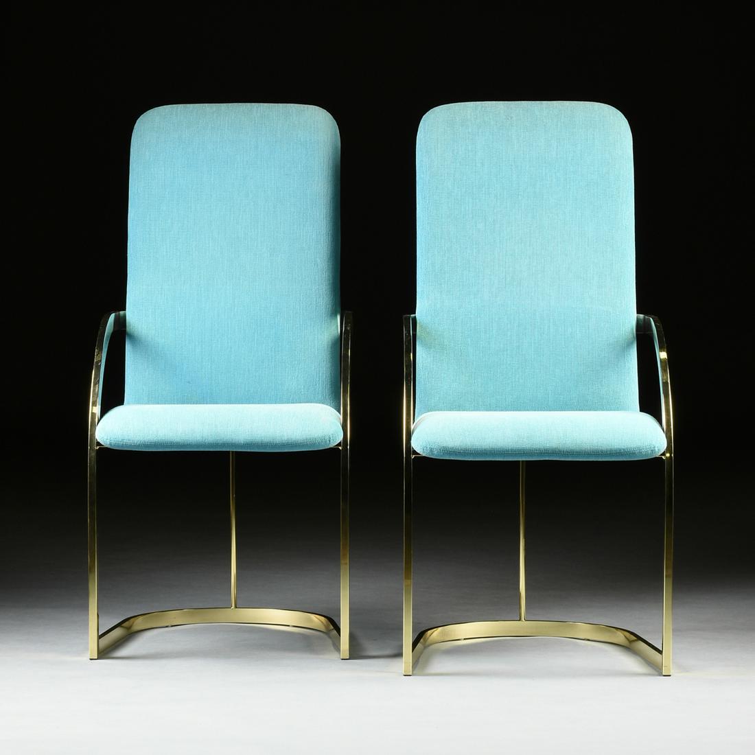 A SET OF FOUR VINTAGE MODERN TURQUOISE BLUE UPHOLSTERED: A SET OF FOUR VINTAGE MODERN TURQUOISE BLUE UPHOLSTERED AND LACQUERED BRASS DINING ARMCHAIRS, BY DESIGN INSTITUTE OF AMERICA, CHICAGO, CIRCA 1970, each with tall rectangular padded backs attached to a