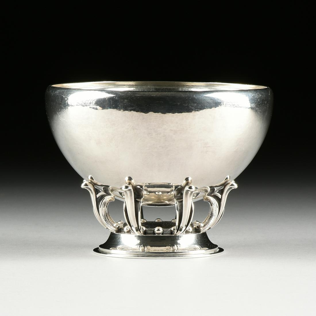 A GEORG JENSEN STERLING SILVER BOWL, DESIGNER GUSTAVE: A GEORG JENSEN STERLING SILVER BOWL, DESIGNER GUSTAVE PEDERSEN (Danish 1895-1972) PATTERN 584B, DENMARK, POST 1945, with rounded rim, raised on paired leaf supports alternating bead details on a confo