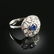 AN ART DECO STYLE 14K WHITE GOLD, SAPPHIRE, AND DIAMOND