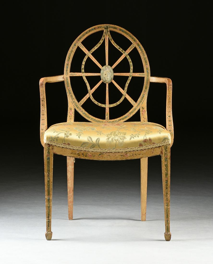 A GEORGE III (1738-1820) NEOCLASSICAL PAINTED ELM AND: A GEORGE III (1738-1820) NEOCLASSICAL PAINTED ELM AND BEECH ARMCHAIR, after designs by THOMAS SHERATON (1751-1806), the oval back centering a hand painted paterae issuing a blue ground band with pink