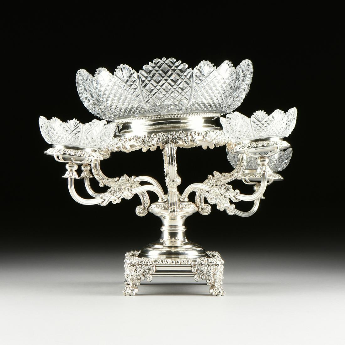 A VICTORIAN CUT CRYSTAL MOUNTED AND SILVER PLATED FOUR: A VICTORIAN CUT CRYSTAL MOUNTED AND SILVER PLATED FOUR BRANCH EPERGNE, LATE 19TH/EARLY 20TH CENTURY, with a circular rope twist detailed rim above a plain inset neck flaring to undulating trim of flor