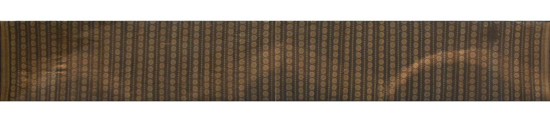 A LONG JAPANESE GILT BULLION AND SILVER SILK THREAD: A LONG JAPANESE GILT BULLION AND SILVER SILK THREAD WOVEN AUBERGINE CEREMONIAL MARU OBI SASH, POSSIBLY TAISHO PERIOD (1912-1927), of extremely long rectangular form and woven with repeating bands of "