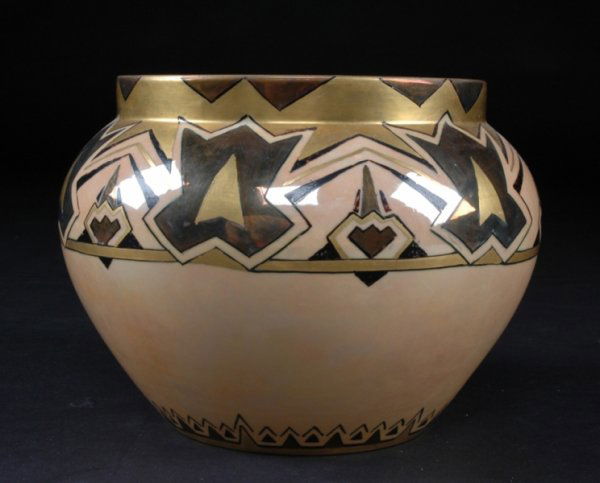 AN ART DECO LUSTER WARE PORCELAIN JARDINIERE by Be: AN ART DECO LUSTER WARE PORCELAIN JARDINIERE by Bernardaud & Company, Limoges, France, the tapered bulbous sides surmounted by a short neck decorated with a broad band of geometric panels alternating