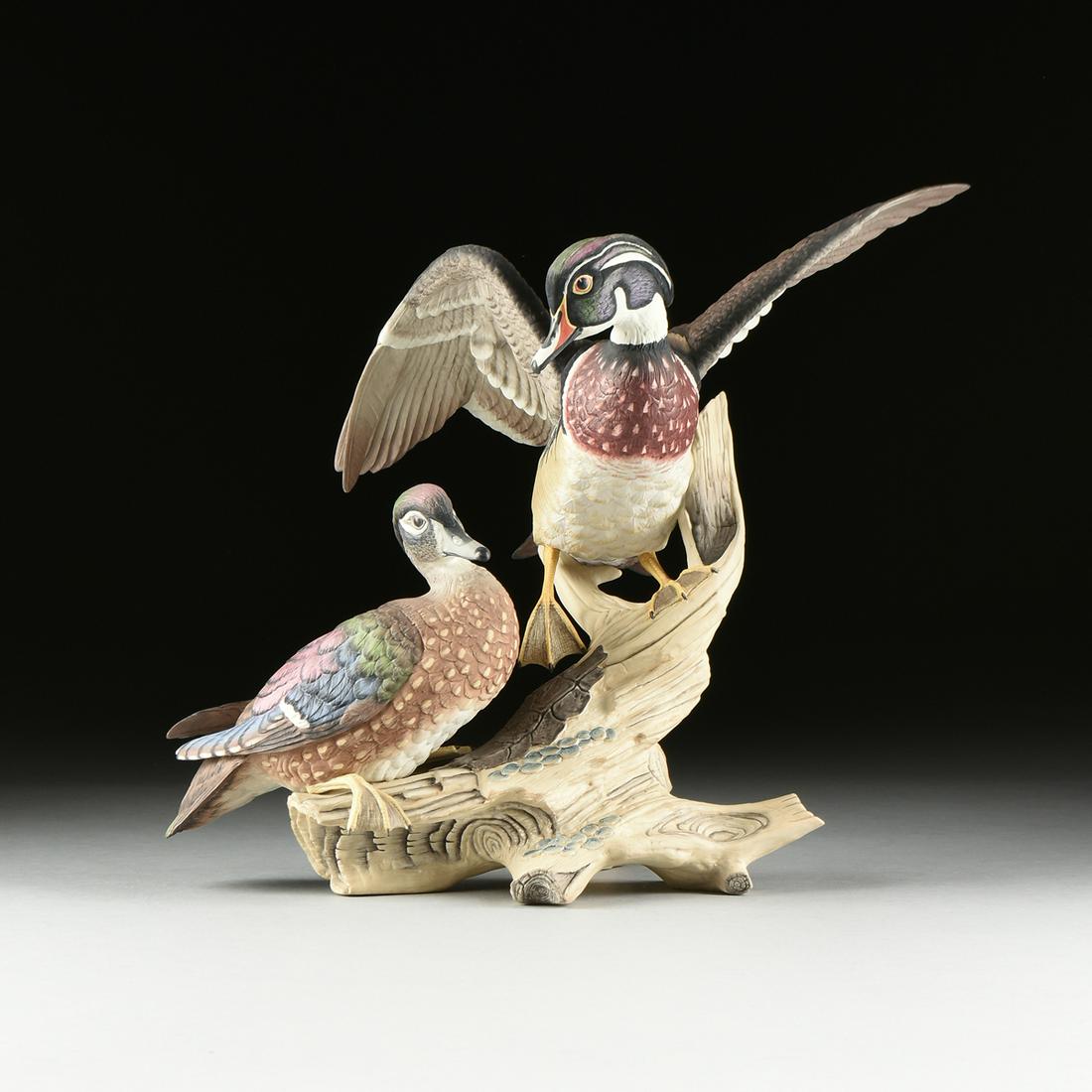 A BOEHM SCULPTURE, "Wood Ducks," UNITED STATES,: A BOEHM SCULPTURE, "Wood Ducks," UNITED STATES, hand painted bisque porcelain, number 34, verso maker's mark. Height: 15.50" Width: 19.00" Depth: 10.50"