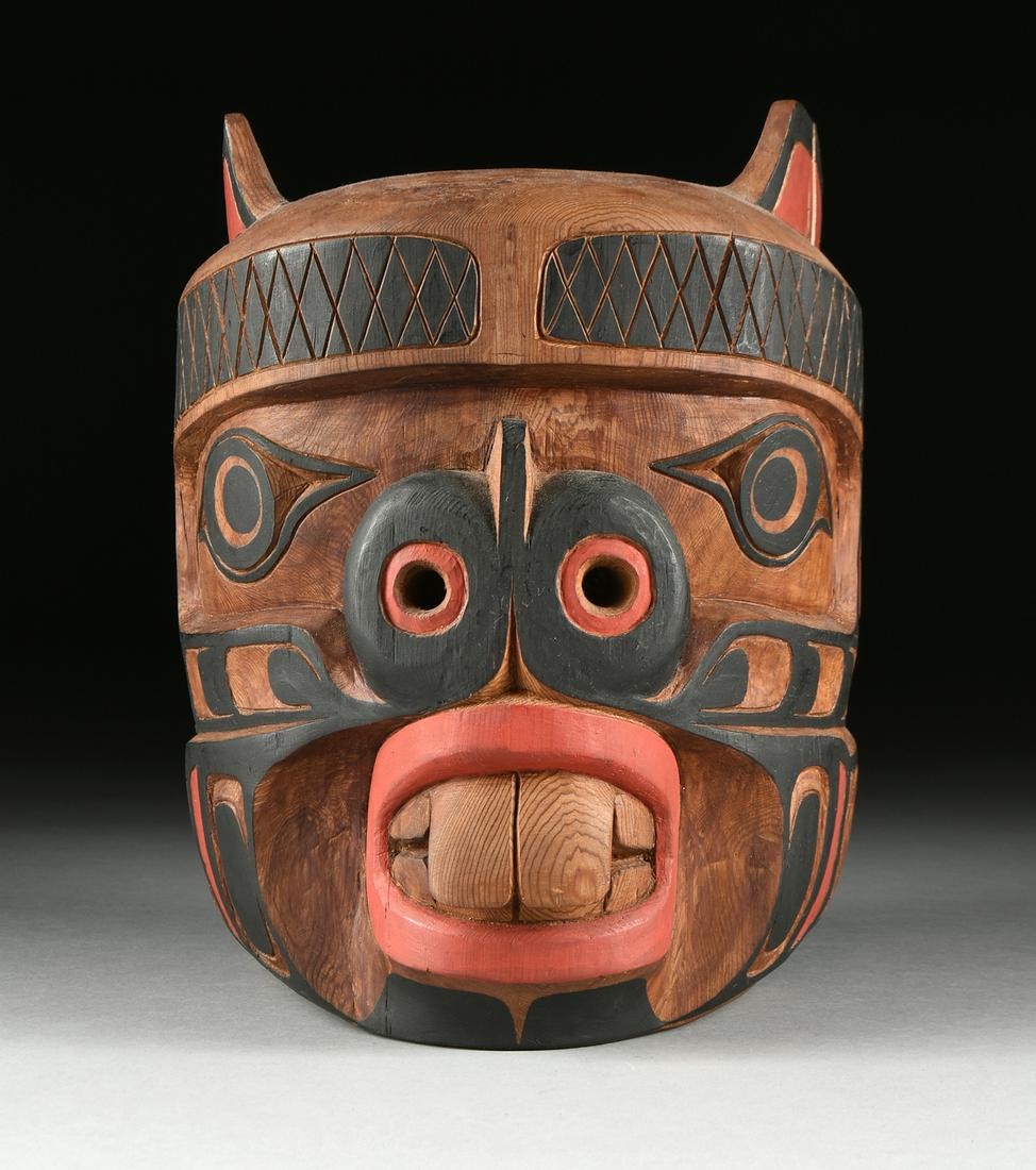 HARRY HUNT (Kwakiutl 1923-1985) AN INDIGENOUS MASK: HARRY HUNT (Kwakiutl 1923-1985) AN INDIGENOUS MASK CARVING, "Beaver," 1981, black and red painted cypress, signed in pencil verso, "Henry Hunt," and dated, height: 11 1/4", diameter: 9".