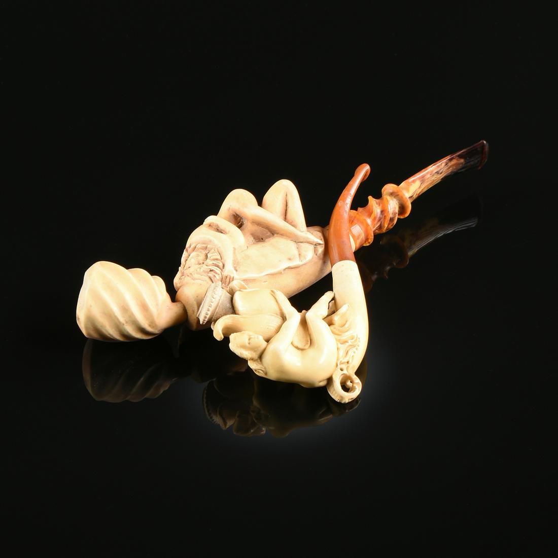 A PAIR OF TWO EROTIC MEERSCHAUM PIPES, LATE 19TH/EARLY: A PAIR OF TWO EROTIC MEERSCHAUM PIPES, LATE 19TH/EARLY 20TH CENTURY, carved in the form of a copulating couple and a nude sprite with flower, largest height: 2", width: 8 1/4".