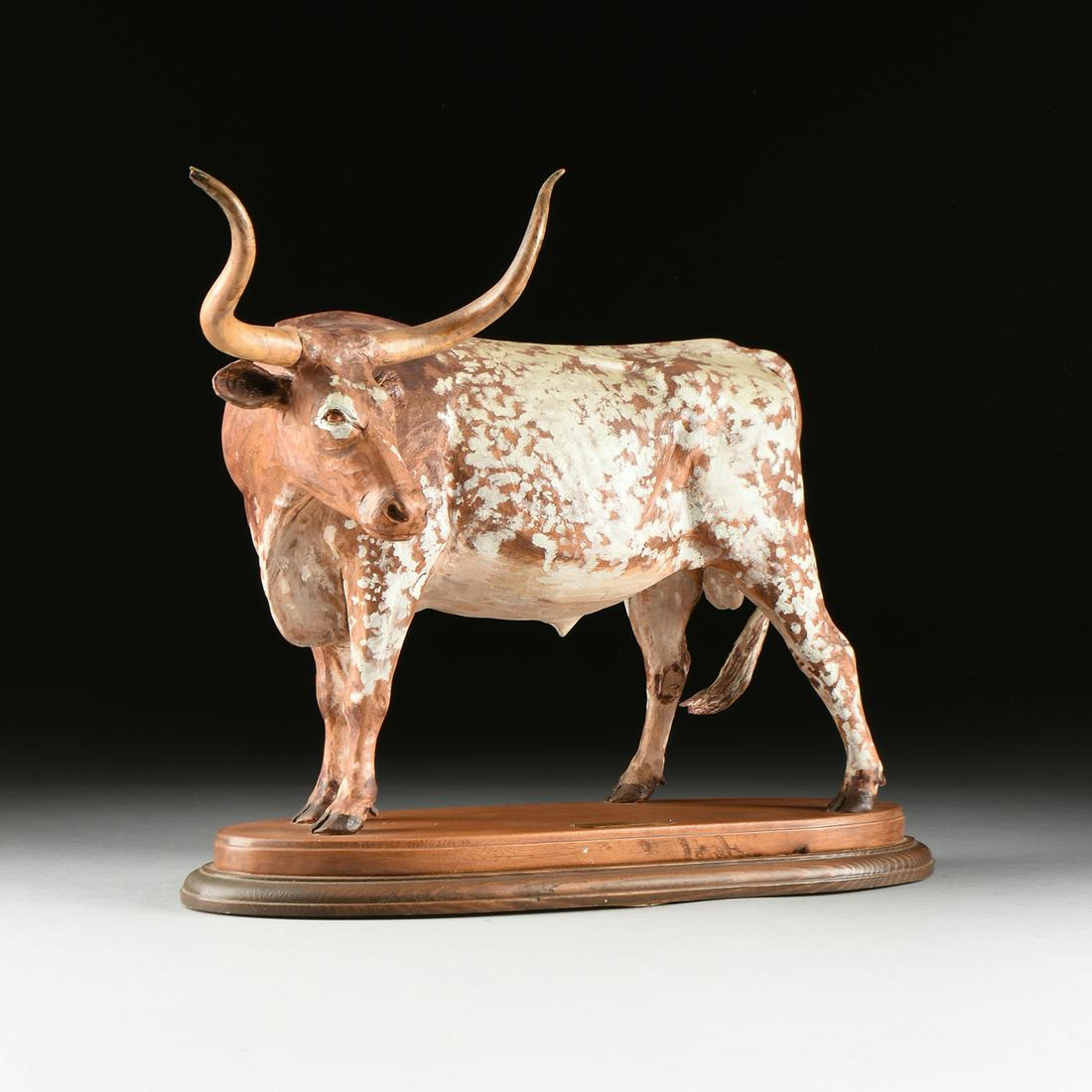 RONALD REED (American 20th Century) A SCULPTURE, "Texas: RONALD REED (American 20th Century) A SCULPTURE, "Texas Longhorn Bull," hand carved and painted wood, signed in monogram on base. Height: 15.00" Width: 14.50" Depth: 7.50"