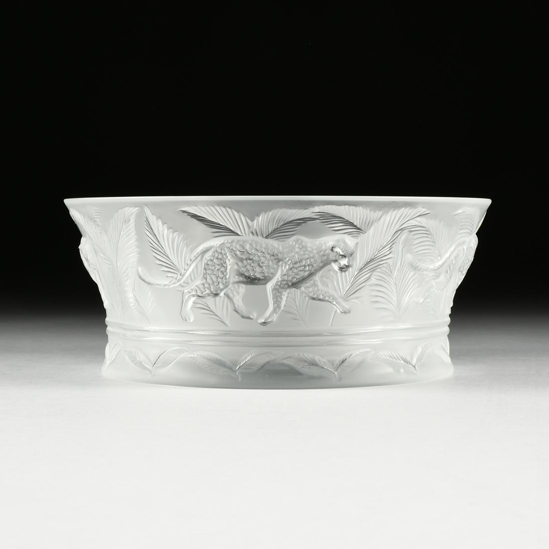 A LALIQUE CLEAR AND FROSTED CRYSTAL "JUNGLE" FRUIT: A LALIQUE CLEAR AND FROSTED CRYSTAL "JUNGLE" FRUIT BOWL, SIGNED, LATE 20TH CENTURY, of flaring circular form and shallow well with sides molded in relief as a continuous band of striding cheetahs befo