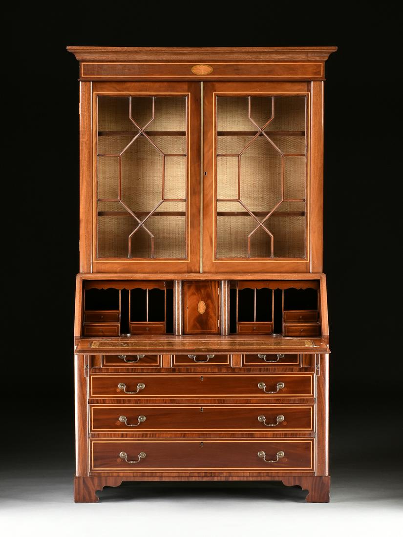 A FEDERAL SATINWOOD INLAID FLAME MAHOGANY DROP FRONT: A FEDERAL SATINWOOD INLAID FLAME MAHOGANY DROP FRONT SECRETARY BOOKCASE, EARLY 19TH CENTURY, the molded rectangular cornice above a frieze centering an oval marquetry fan within a conforming green tin