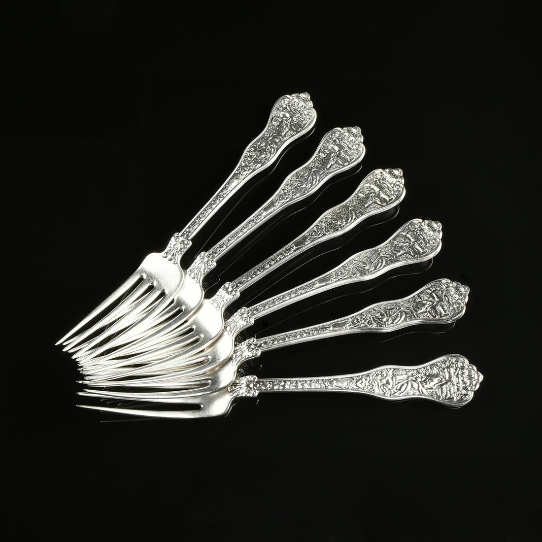 A RARE SET OF TWELVE TIFFANY & CO. STERLING SILVER: A RARE SET OF TWELVE TIFFANY & CO. STERLING SILVER DINNER FORKS, OLYMPIAN PATTERN, ZEUS WITH HIS CHILDREN, NEW YORK, CIRCA 1878, designed under the direction of prolific American silversmith Edward C.