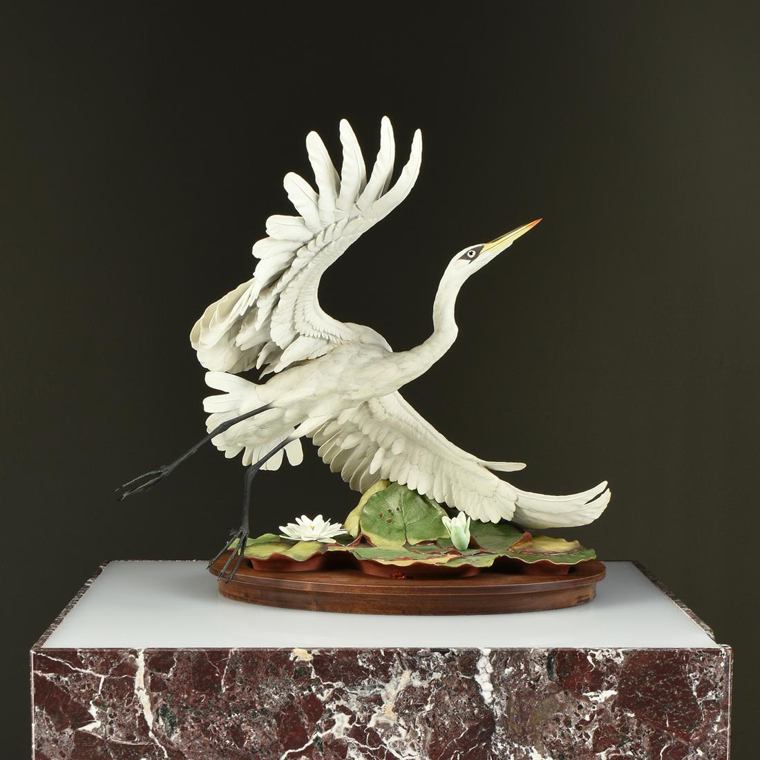 A BOEHM LIMITED EDITION PORCELAIN "Great White Egret": A BOEHM LIMITED EDITION PORCELAIN "Great White Egret" SCULPTURE, SIGNED, 1982, realistically modeled and hand painted in authentic natural colors, depicted as a spread winged egret ascending from a cl