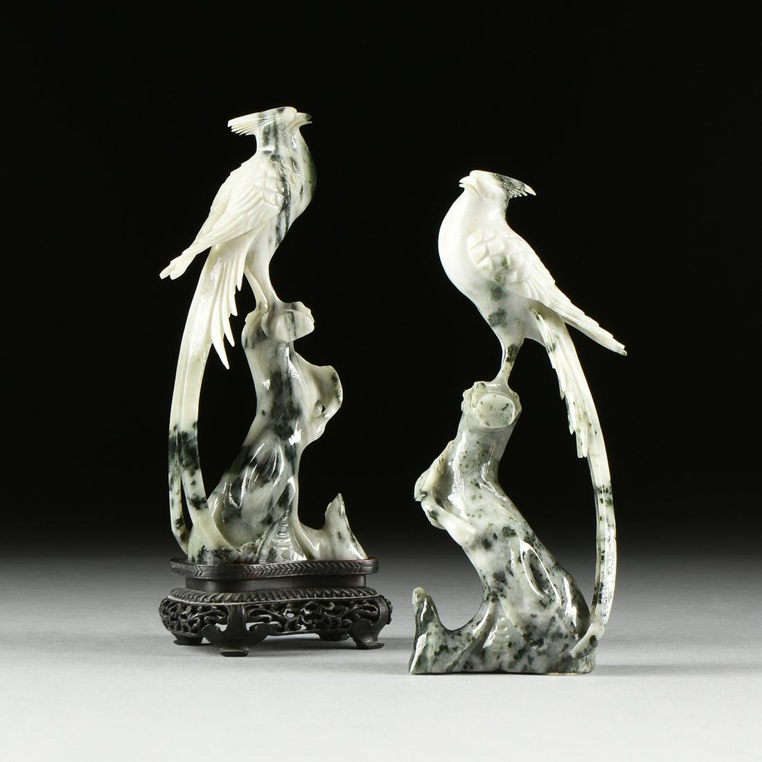 A PAIR OF MOSS IN SNOW JADE BIRD FIGURINES, CHINESE: A PAIR OF MOSS IN SNOW JADE BIRD FIGURINES, CHINESE REPUBLIC PERIOD (1912-1949), each plumed hair on tilted head with slightly open beak revealing a delicate tongue, the wings cross and long tail feat