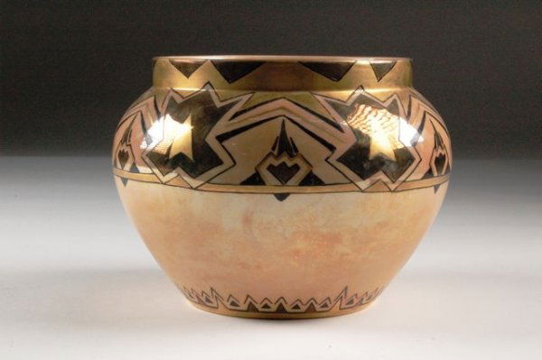 AN ART DECO LUSTER WARE PORCELAIN JARDINIERE by Be: AN ART DECO LUSTER WARE PORCELAIN JARDINIERE by Bernardaud & Company, Limoges, France, the tapered bulbous sides surmounted by a short neck decorated with a broad band of geometric panels alternating