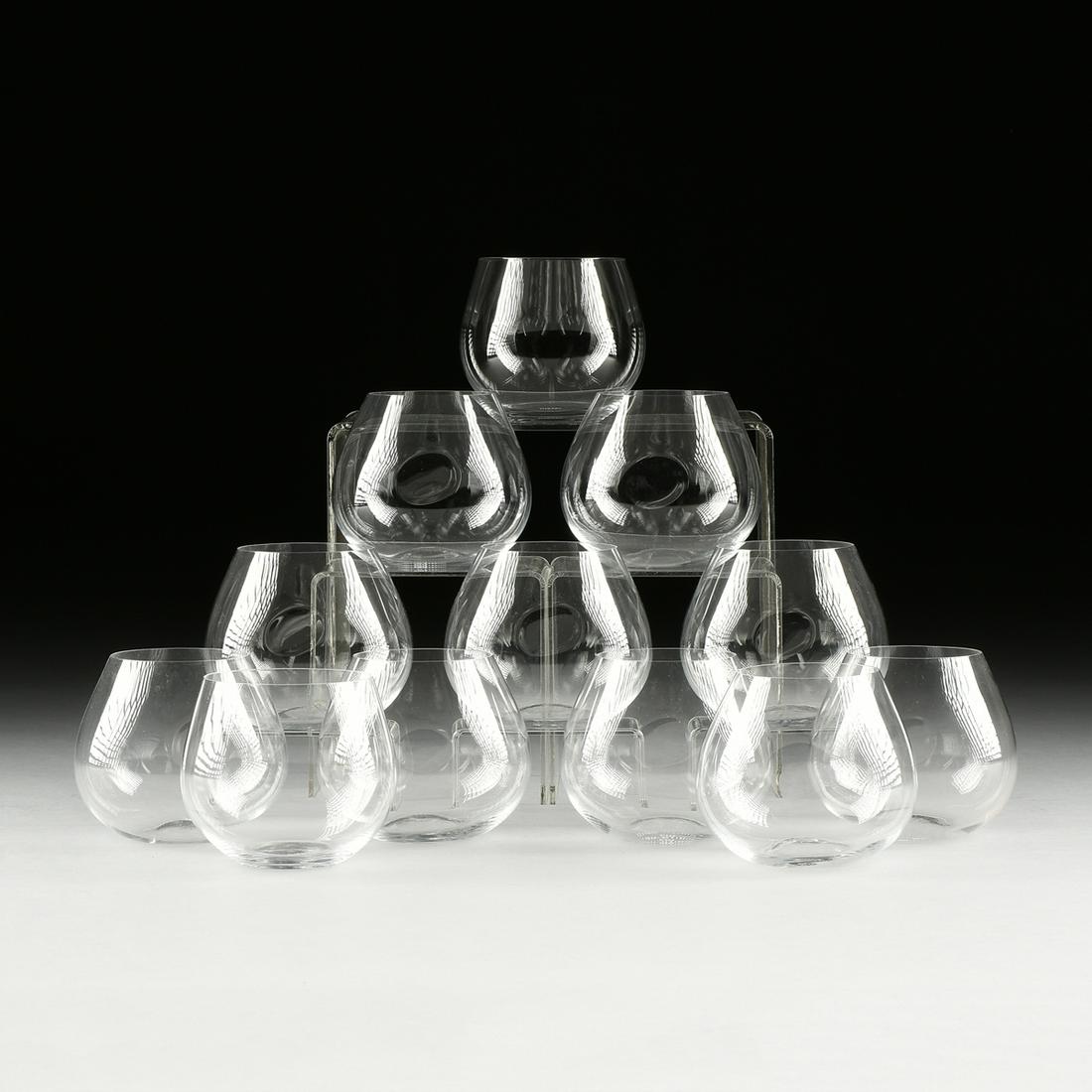 A SET OF TWELVE TIFFANY & CO. ELSA PERETTI DESIGNED: A SET OF TWELVE TIFFANY & CO. ELSA PERETTI DESIGNED THUMB PRINT WINE GLASSES, SPANISH, MODERN, clear crystal with thumb indention, verso the acid-etched manufacturer's mark. Height: 4" Provenance: Pro