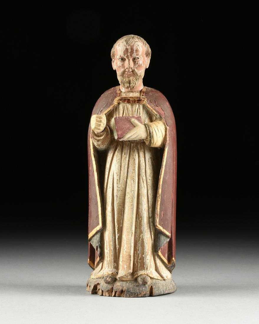 A PAINTED WOOD SANTO OF ST. NICHOLAS THE MIRACLE: A PAINTED WOOD SANTO OF ST. NICHOLAS THE MIRACLE WORKER, 19TH CENTURY, polychrome carved wood, in the Spanish Colonial taste, the rigid figure stands and holds a book. Height: 14 1/2" Diameter: 5" Pro