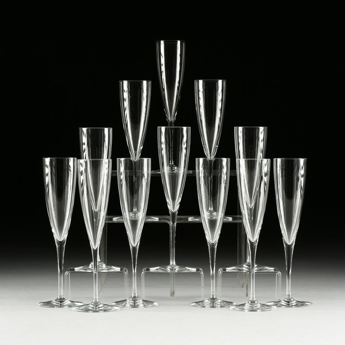 A SET OF TWELVE BACCARAT "DOM PERIGNON" CRYSTAL: A SET OF TWELVE BACCARAT "DOM PERIGNON" CRYSTAL CHAMPAGNE FLUTES, MODERN, clear blown five-ounce flute, verso manufacturer's acid-etched mark. Height: 9 3/8" Provenance: Property from a Prominent Rive