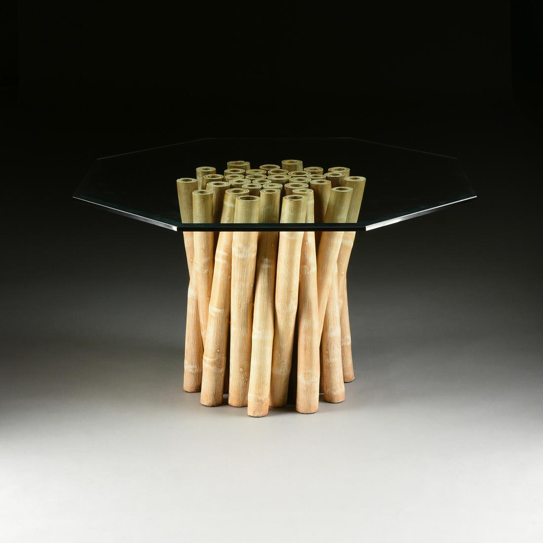 A VINTAGE MODERN AMERICAN GLASS TOPPED AND WHITEWASHED: A VINTAGE MODERN AMERICAN GLASS TOPPED AND WHITEWASHED BAMBOO CENTER TABLE, BY BUDJI LAYUG, CIRCA 1980, with a thick bevel edged octagonal glass top raised on large cut and whitewashed bamboo stalks i