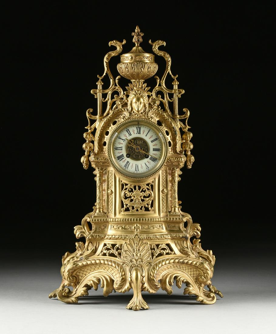 A RENAISSANCE REVIVAL BRONZE MANTLE CLOCK, FRENCH,: A RENAISSANCE REVIVAL BRONZE MANTLE CLOCK, FRENCH, THIRD QUARTER 19TH CENTURY, the elaborately cast arched rectangular case surmounted by a lidded foliate urn with foliate wrapped bud finial, flanked 