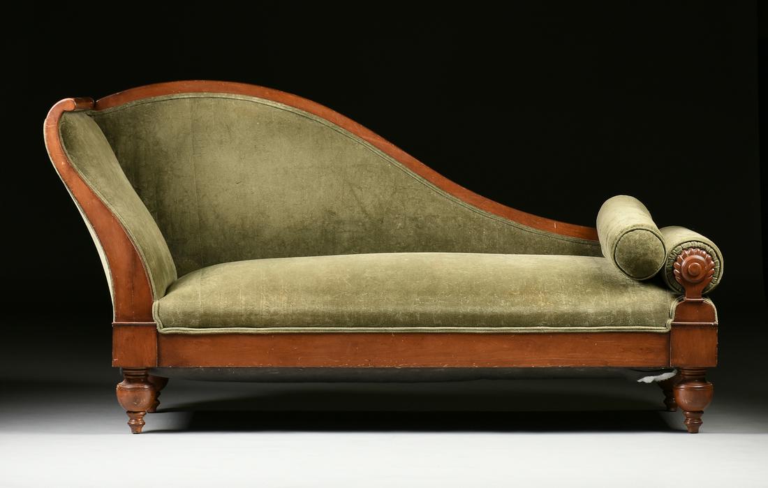 A BIEDERMEIER VELVET UPHOLSTERED FRUITWOOD RECAMIER,: A BIEDERMEIER VELVET UPHOLSTERED FRUITWOOD RECAMIER, CIRCA 1830, the "S" form padded headboard on a long rectangular padded seat and one arched padded side tapering to a carved reeding cylindrical pad