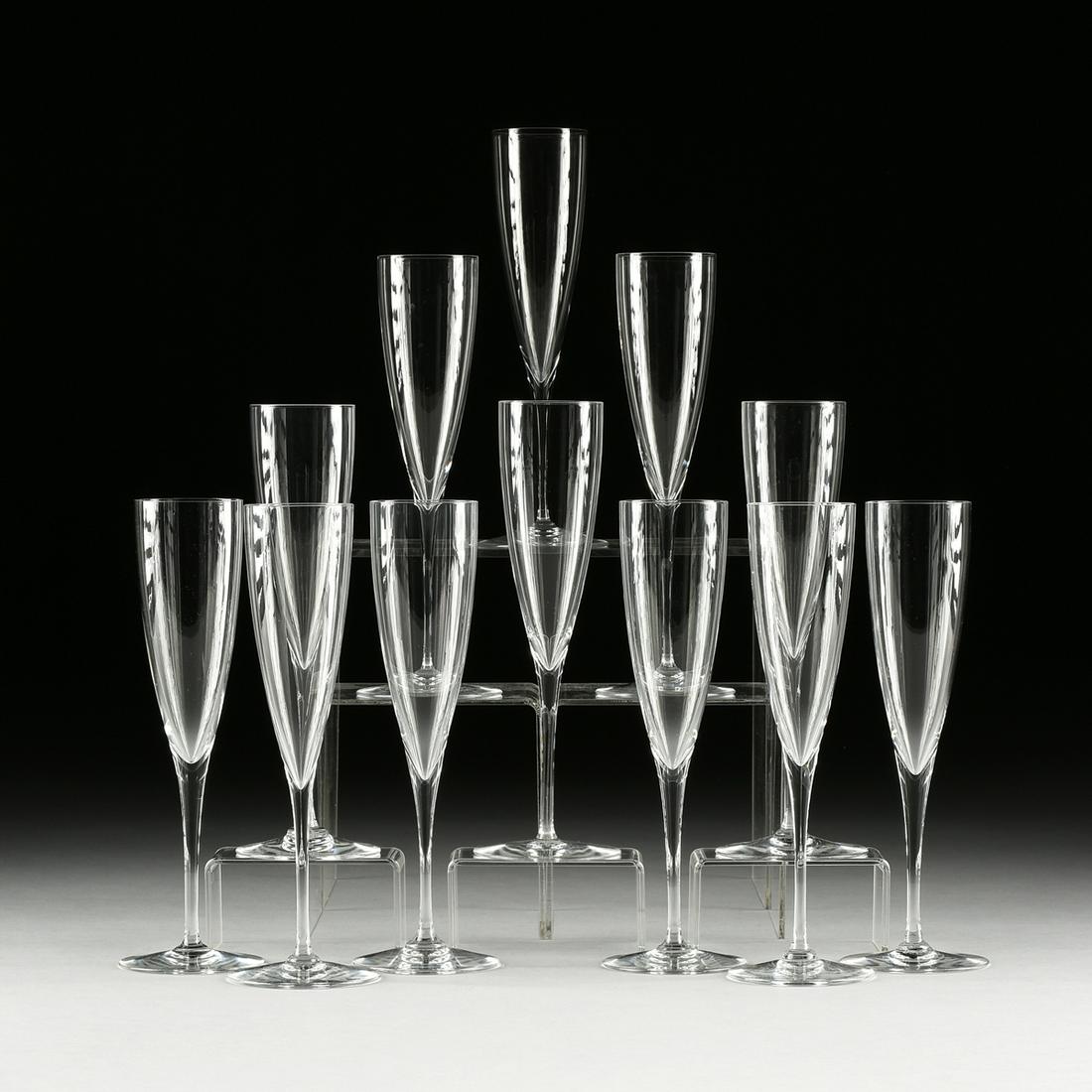 A SET OF TWELVE BACCARAT "DOM PERIGNON" CRYSTAL: A SET OF TWELVE BACCARAT "DOM PERIGNON" CRYSTAL CHAMPAGNE FLUTES, LATE 20TH CENTURY, clear blown five-ounce flute, verso manufacturer's acid-etched mark. Height: 9 3/8" Provenance: Property from a Pro