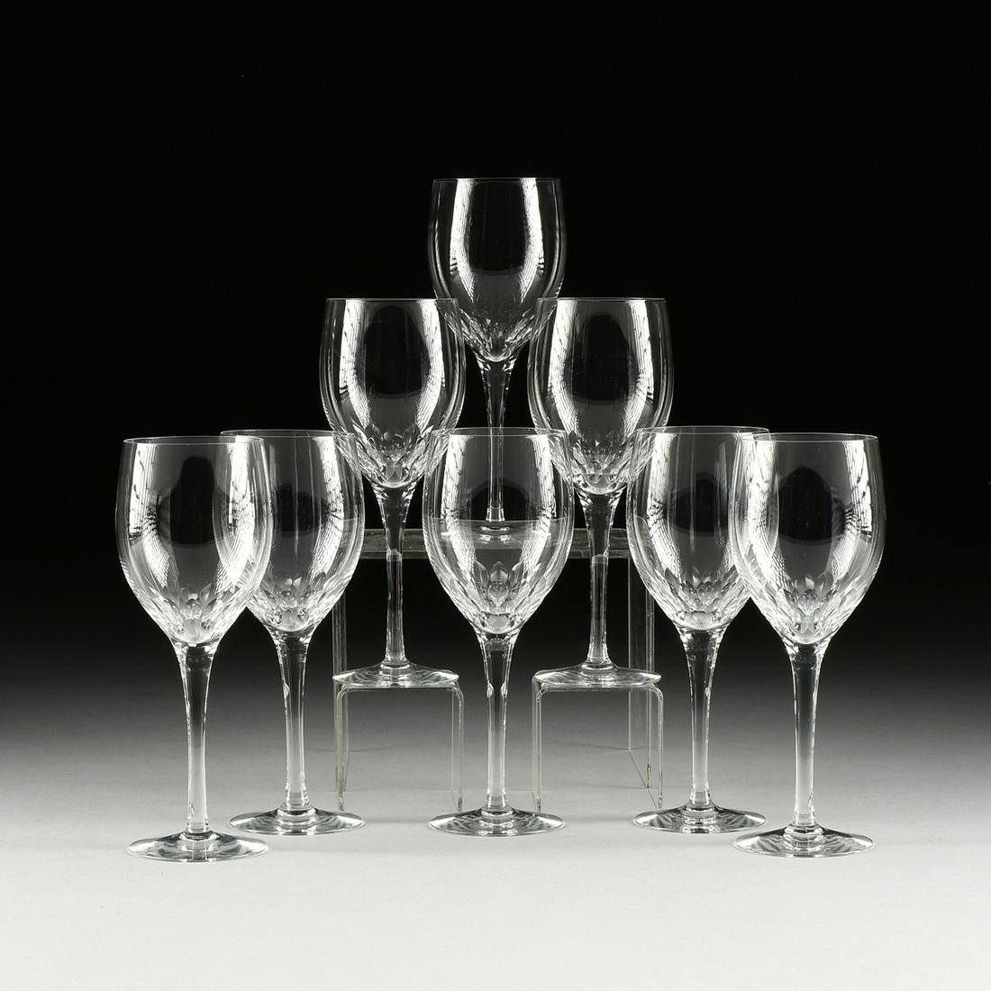 A SET OF EIGHT CUT CRYSTAL WINE GLASSES, MODERN,: A SET OF EIGHT CUT CRYSTAL WINE GLASSES, MODERN, the petal cut cup on an elegant stem ending on a circular foot. Height: 9" Provenance: Property from a Prominent River Oaks Estate Collection, Houston,
