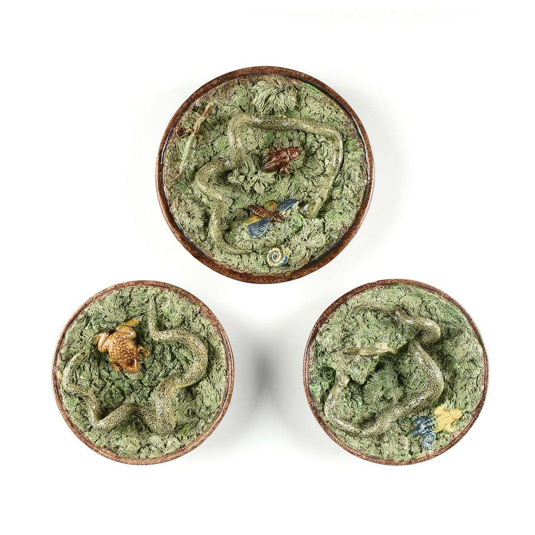 THREE MAFRA & SONS CALDAS PALISSY WARE MAJOLICA PLATES,: THREE MAFRA & SONS CALDAS PALISSY WARE MAJOLICA PLATES, INSECT AND REPTILE, LATE 19TH CENTURY, each hand painted and modeled glazed earthenware, from smallest to largest: a footed plate with a coiling