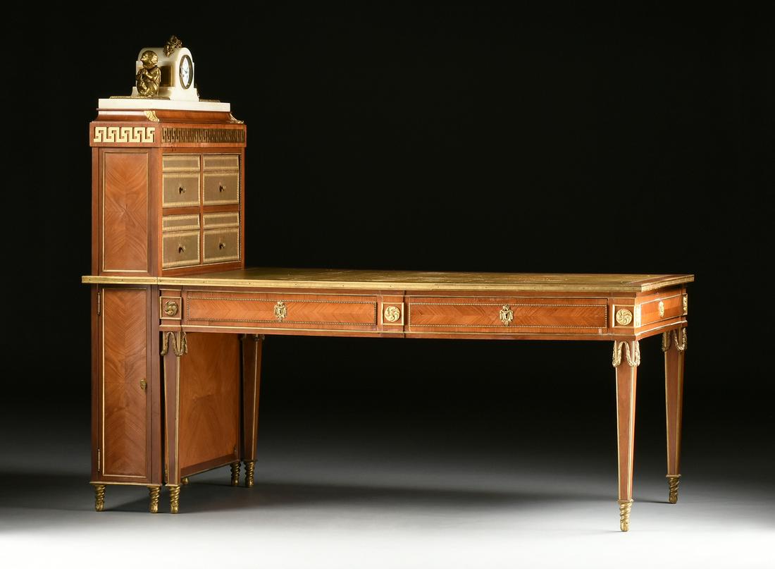 A FINE LOUIS XVI STYLE ORMOLU MOUNTED TULIPWOOD BUREAU: A FINE LOUIS XVI STYLE ORMOLU MOUNTED TULIPWOOD BUREAU PLAT AND CARTONNIER, EARLY 20TH CENTURY, in the gout Grec taste,the associated white marble clock with gilt bronze putti centering a circular whi