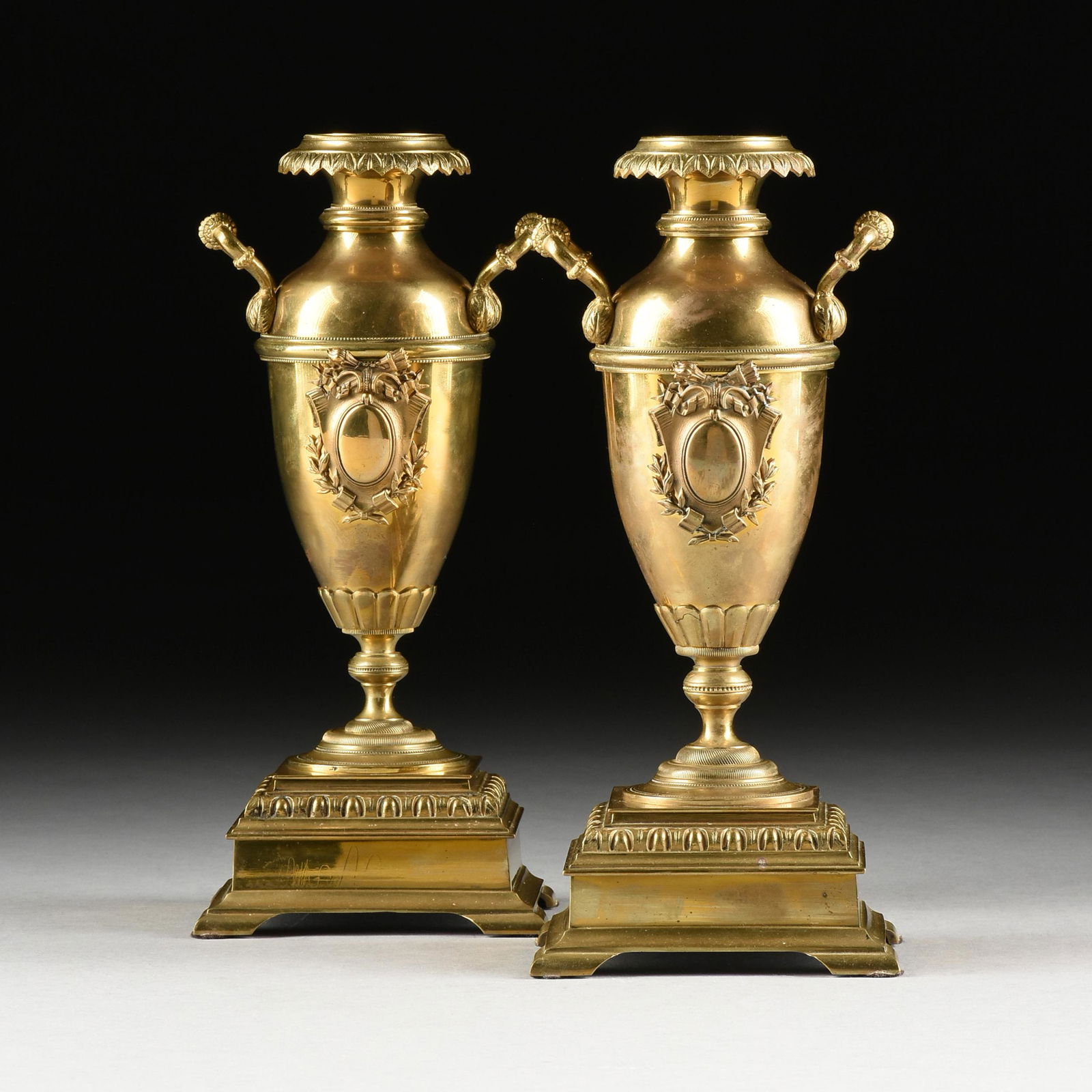 A PAIR OF VICTORIAN TWO HANDLED POLISHED BRASS VASES, (1 of 10)