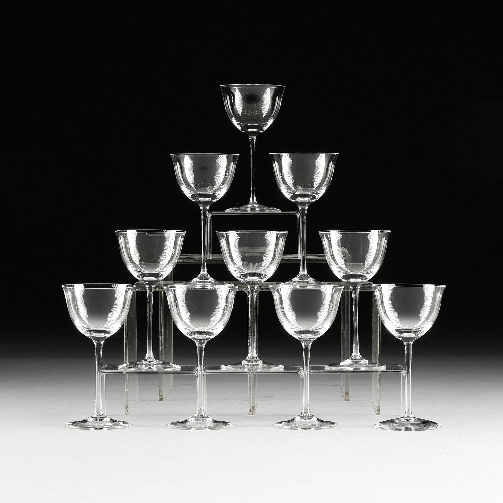 AN ASSEMBLED SET OF TEN LOBMEYR "PATRICIAN" LIQUEUR: AN ASSEMBLED SET OF TEN LOBMEYR "PATRICIAN" LIQUEUR COCKTAIL STEMWARE, JOSEF HOFFMAN, AUSTRIAN, DESIGNED 1917, blown molded muslin glass with clear flared bowls on thin stems. Height: 5 1/8" Diameter: