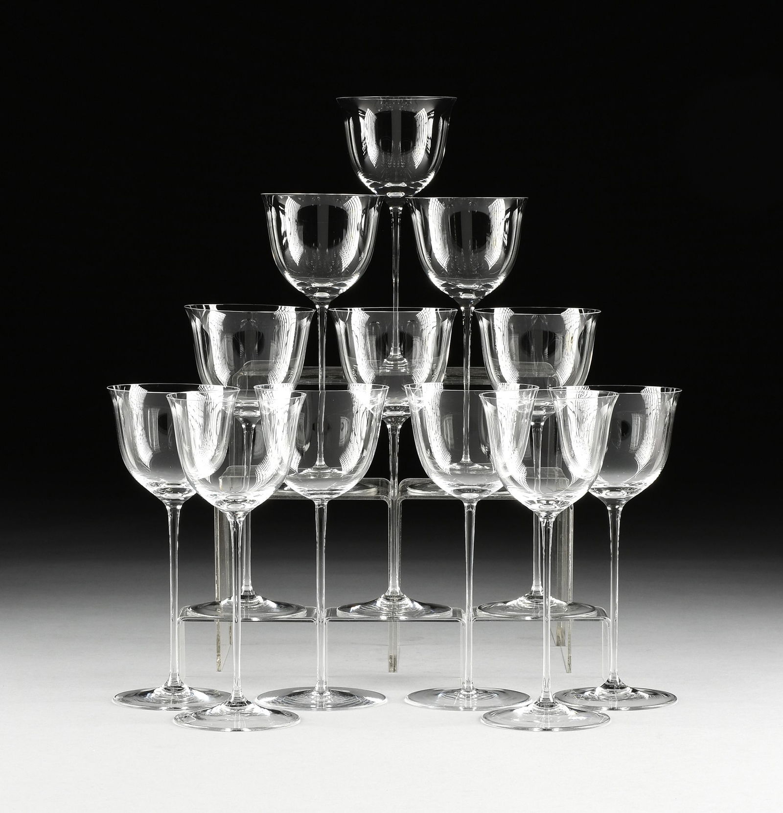 A GROUP OF TWELVE LOBMEYR "PATRICIAN" WINE HOCK: A GROUP OF TWELVE LOBMEYR "PATRICIAN" WINE HOCK STEMWARE, JOSEF HOFFMANN, AUSTRIAN, DESIGNED 1917, blown molded muslin glass with clear flared bowls on thin stems. Height: 8 3/8" Note: The Patrician p